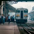 A train and busy platform at Yangon's central railway station, Myanmar