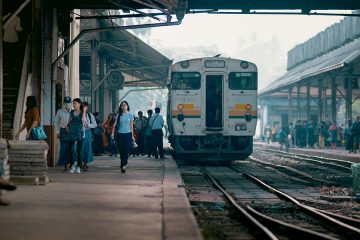 A train and busy platform at Yangon's central railway station, Myanmar