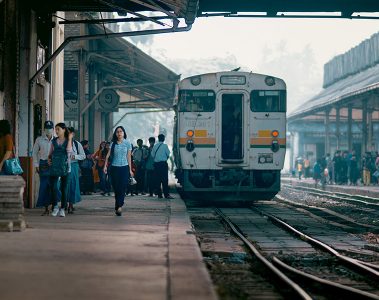 A train and busy platform at Yangon's central railway station, Myanmar